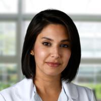 A professional headshot of Dr. Zaidi